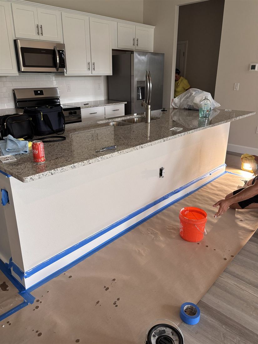 Kitchen island before: a plain white painted panel